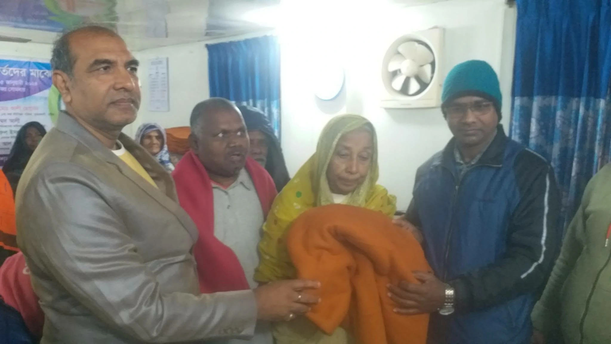 A warm blanket being presented indoors